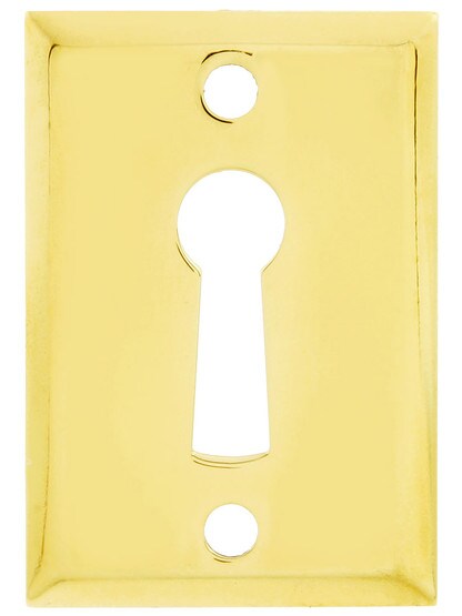 Rectangular Stamped Brass Keyhole Cover - 1 11/16 inch x 1 3/16 inch in Un-Lacquered Brass.
